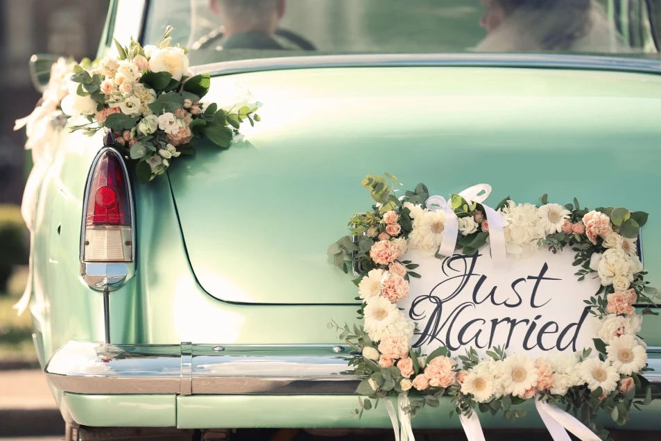 The back of a car with a "Just Married" sign during the ceremonies.